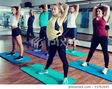 People relaxing and enjoying yoga People relaxing and enjoying yoga 33762645