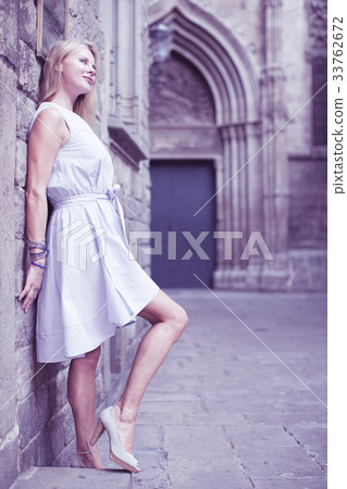 cheerful woman near the brick wall cheerful woman near the brick wall 33762672