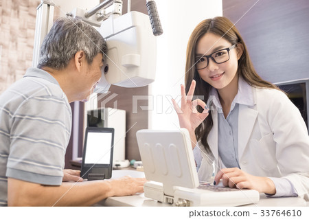 old man with optometrist old man with optometrist 33764610