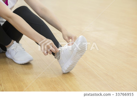 Woman feet wearing shoes in fitness studio 33766955