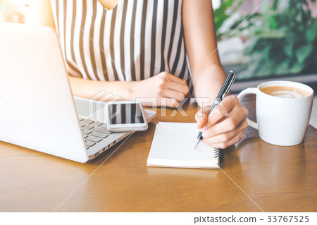 Business woman hand working at a computer Business woman hand working at a computer 33767525