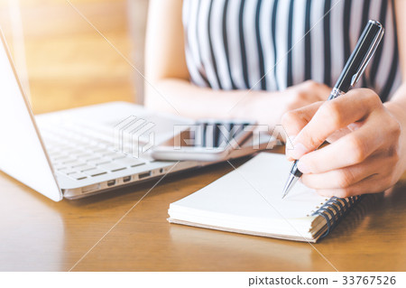 Business woman hand working at a computer Business woman hand working at a computer 33767526