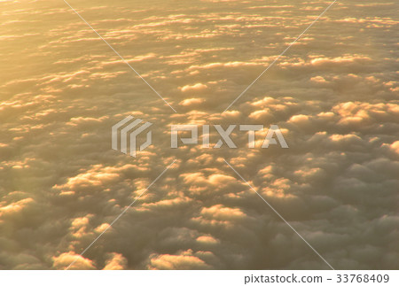 view over white fluffy cloud with sunrise view over white fluffy cloud with sunrise 33768409