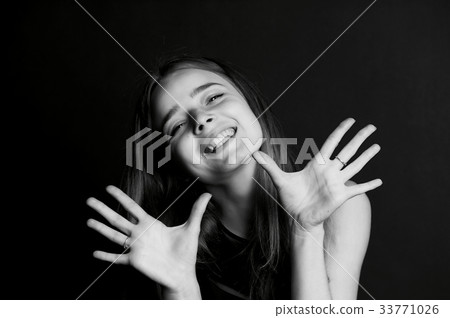 Emotional portrait of a beautiful girl with long 33771026