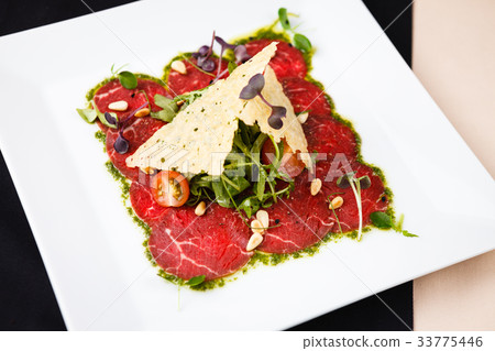Beef carpaccio with salad 33775446