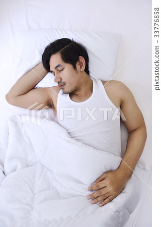 Handsome asian man sleep tightly Handsome asian man sleep tightly 33776858