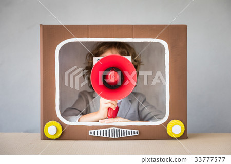 Child playing with cartoon TV Child playing with cartoon TV 33777577