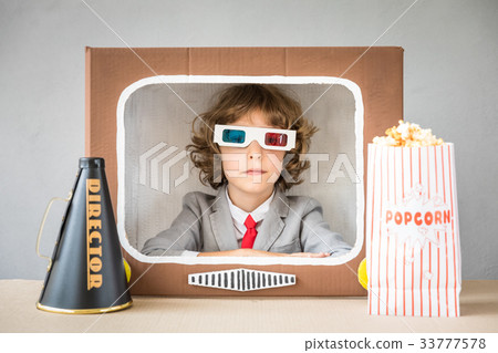 Child playing with cartoon TV Child playing with cartoon TV 33777578