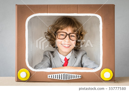 Child playing with cartoon TV Child playing with cartoon TV 33777580