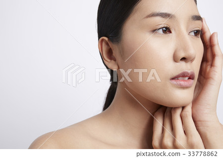 portrait of an Asian woman posing in a white background 33778862
