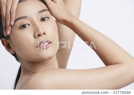 portrait of a beautiful model posing in a studio 33778886