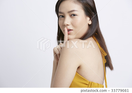 portrait of beautiful woman making silent sign portrait of beautiful woman making silent sign 33779081