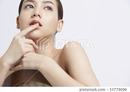 naked woman is sitting and touching her lips naked woman is sitting and touching her lips 33779096