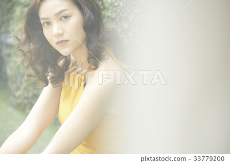 The picture of girl knitting the eyebrows and looking 33779200