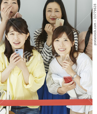 Women participating in the event Women participating in the event 33779828