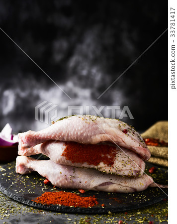 raw chicken legs ready to be cooked 33781417