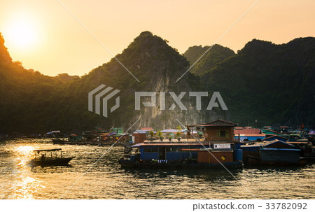 Sunset over fisherman village in Halong bay, Vietn Sunset over fisherman village in Halong bay, Vietn 33782092