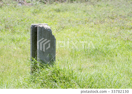 Concrete pile on the green grass of the grass. Concrete pile on the green grass of the grass. 33782130