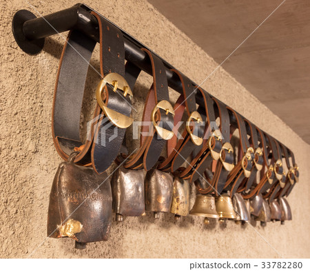 Swiss cowbells hanging at an farm in the Alps 33782280