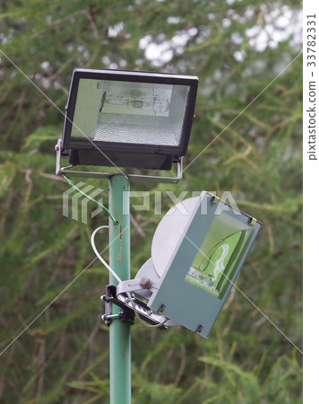 Security light in a forest 33782331
