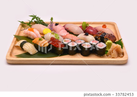 Mixed sushi set in brown wooden tray Mixed sushi set in brown wooden tray 33782453