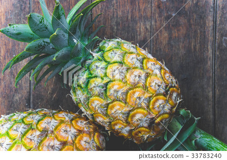pineapple fruit on wood table 33783240