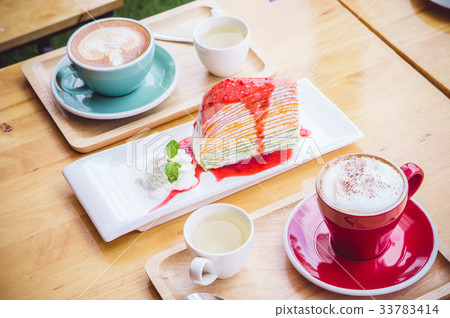 coffee red cup cappuccino and cake on table 33783414