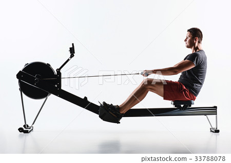 Man Using A Press Machine In A Fitness Club. 33788078