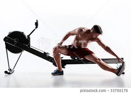 Man Using A Press Machine In A Fitness Club. 33788176