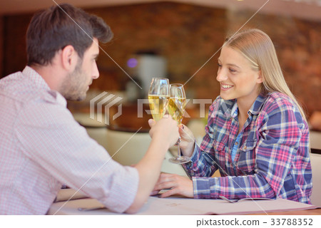 Happy lovers celebrating their anniversary Happy lovers celebrating their anniversary 33788352