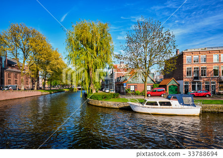 Boats, houses and canal. Harlem, Netherlands 33788694