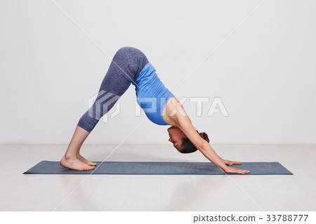 Woman doing Ashtanga Vinyasa yoga asana Adhomukha Woman doing Ashtanga Vinyasa yoga asana Adhomukha 33788777