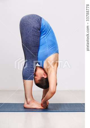 Woman doing Ashtanga Vinyasa yoga asana 33788778