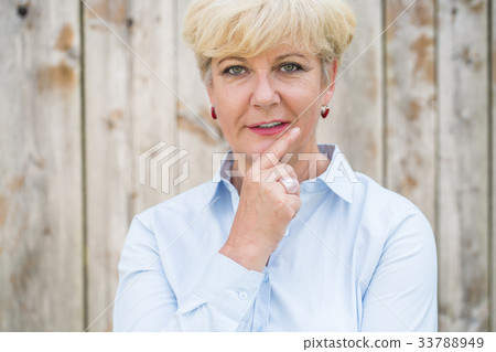 Portrait of an active senior woman looking at 33788949