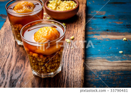 Mote con huesillo. Traditional Chilean drink made 33790481