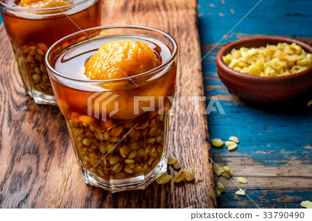 Mote con huesillo. Traditional Chilean drink made Mote con huesillo. Traditional Chilean drink made 33790490