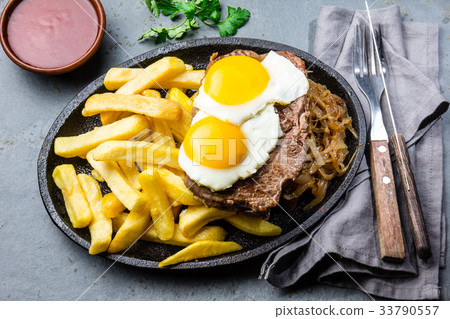 Peruvian Latin American food. Lomo a lo pobre Peruvian Latin American food. Lomo a lo pobre 33790557