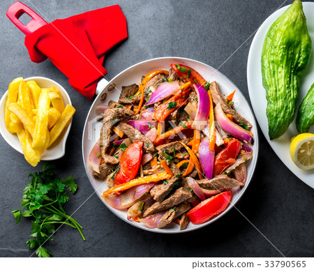 Peruvian dish Lomo saltado - beef tenderloin with 33790565