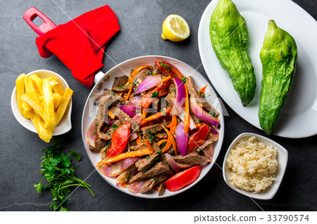 Peruvian dish Lomo saltado - beef tenderloin with 33790574