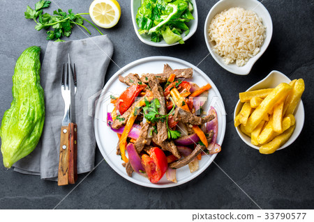 Peruvian dish Lomo saltado - beef tenderloin with 33790577