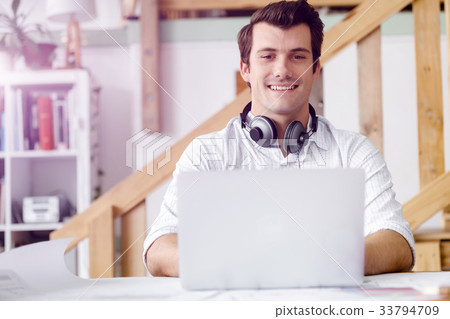 Young businessman in office Young businessman in office 33794709