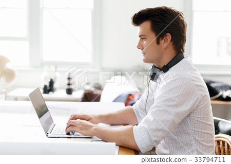 Young businessman in office Young businessman in office 33794711