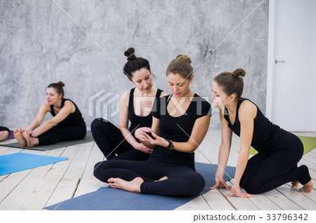 Cute girl sitting and socializing with the group Cute girl sitting and socializing with the group 33796342