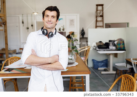 Portrait of young man wearing casual in office Portrait of young man wearing casual in office 33796343