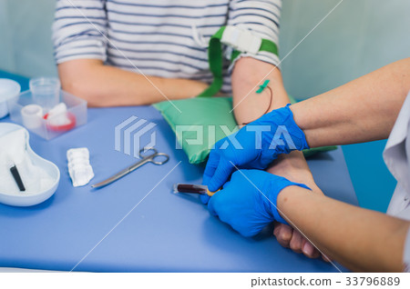 Preparation for blood test with pretty young blond Preparation for blood test with pretty young blond 33796889