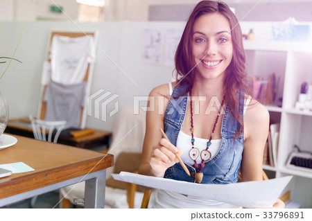 Young woman standing in creative office Young woman standing in creative office 33796891