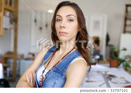 Young woman standing in creative office 33797101