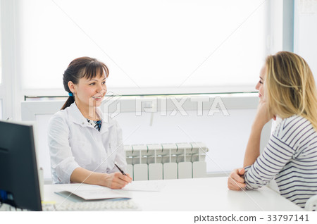 Horizontal view of happy patient at doctor's Horizontal view of happy patient at doctor's 33797141