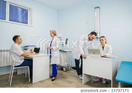 Group Of Doctors Involved In Serious Discussion Group Of Doctors Involved In Serious Discussion 33797173