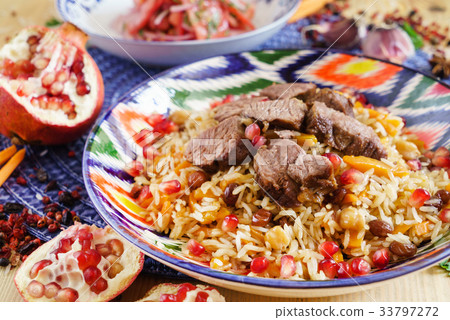 pilaf with beef, vegetables and pomegranate seeds pilaf with beef, vegetables and pomegranate seeds 33797272